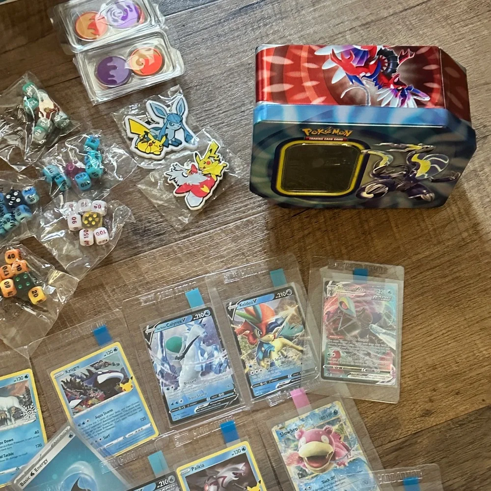 Pokemon Card Collection with Tins and Accessories 25 card Mystery Tin plus bonus